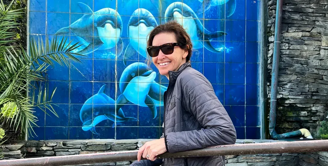  a woman in front of the Wyand art gallery in Laguna Beach 