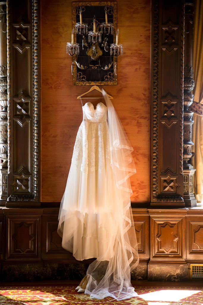 A wedding dress is hanging on a hanger at the Jonathan Club in Downtown LA