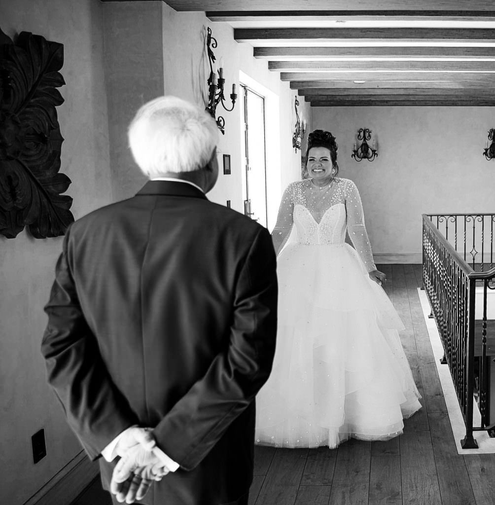 A black and white photo of a bride and her father at Malibu Rocky Oaks