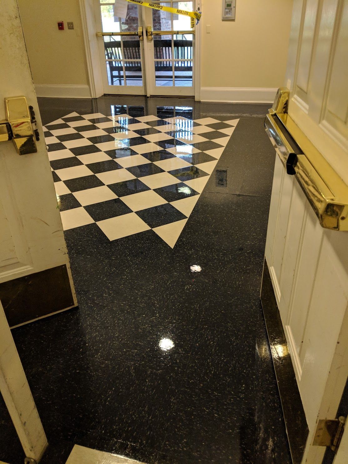A polished flooring combining a classic black-and-white checkered pattern A polished flooring combining a classic black-and-white checkered pattern