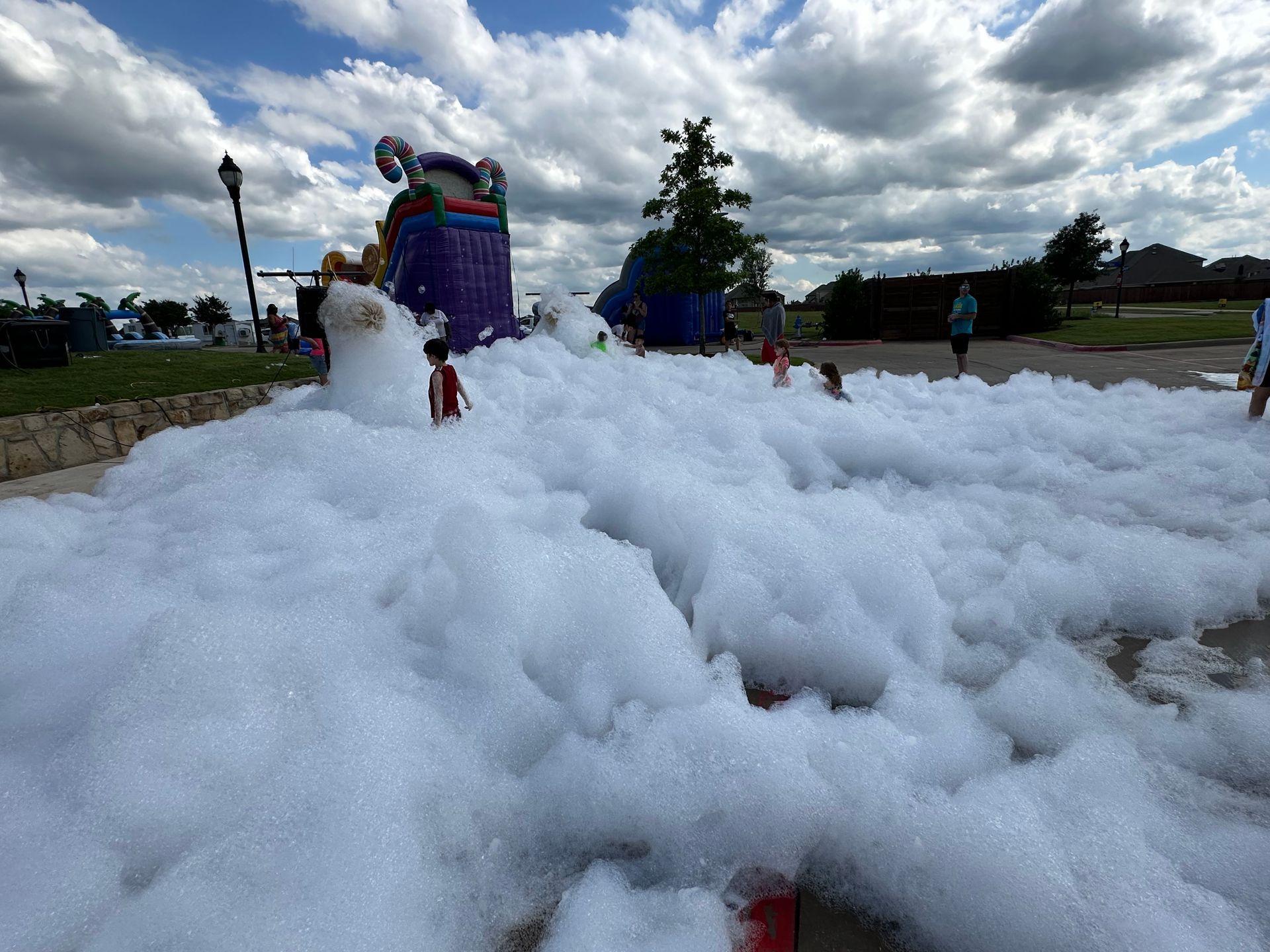 Photo of kids playing in a foam solution.