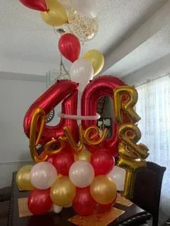 A bunch of balloons are sitting on top of a table.