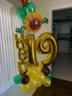 A bunch of balloons are sitting on top of each other in a room.