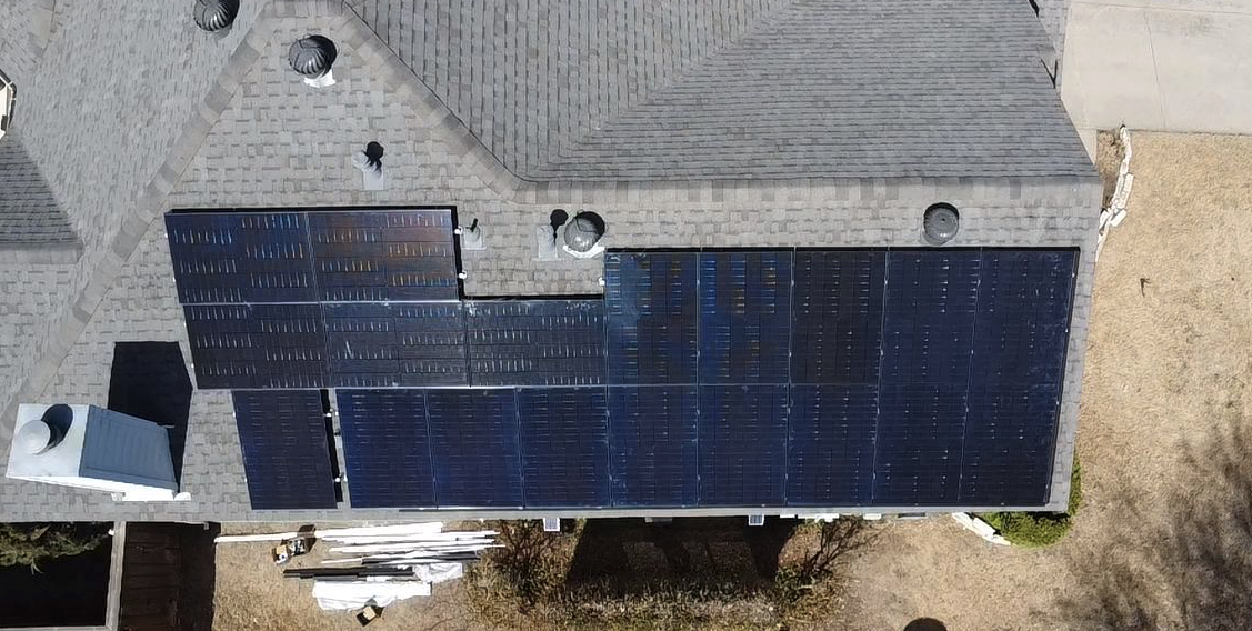 A roof with a lot of solar panels on it