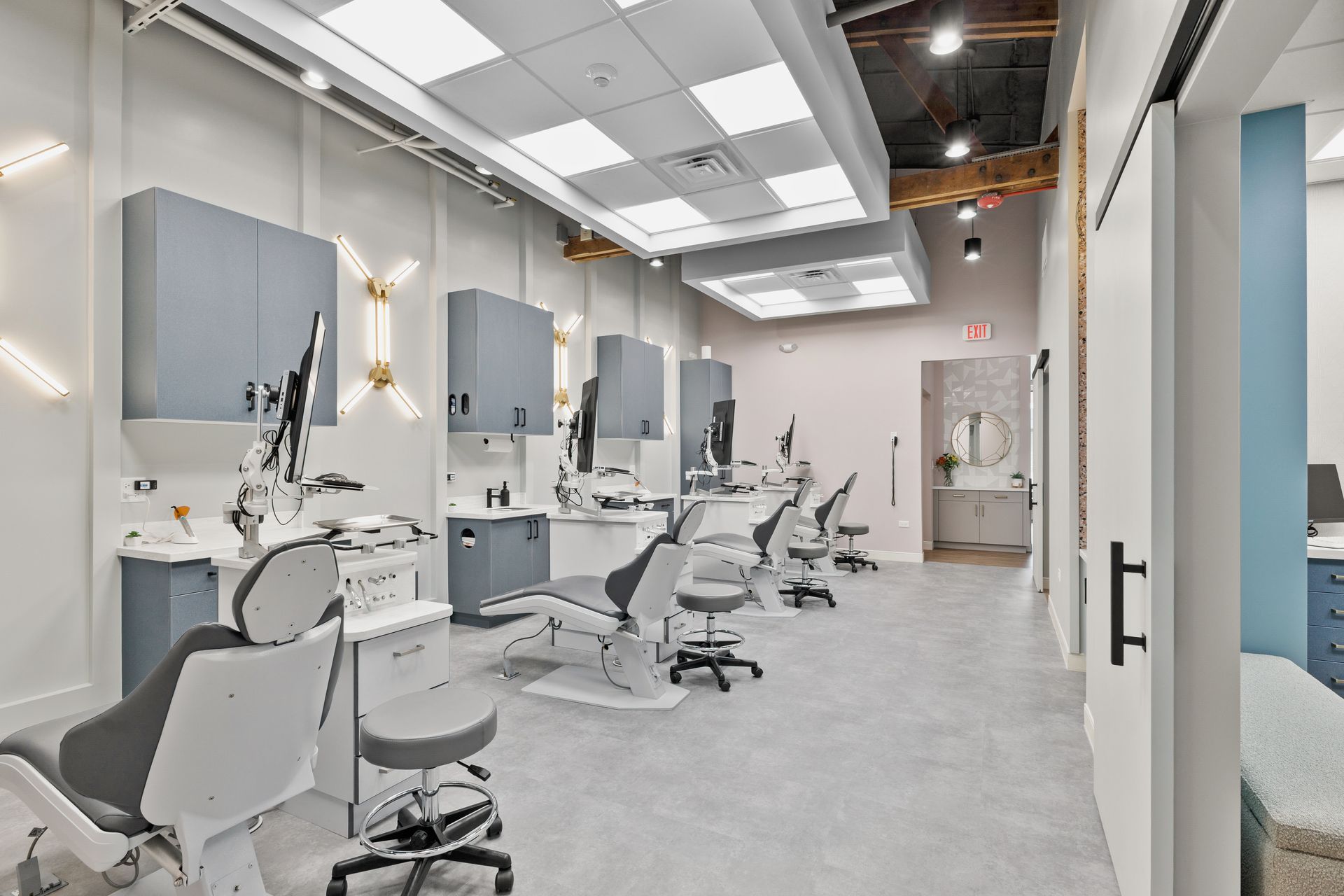 Modern hair salon interior with white styling chairs, mirrors, and bright ceiling lights