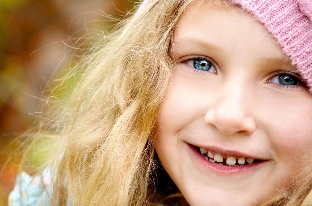 Little girl with blue eyes and spacing teeth — Buffalo Grove, IL — Rosen Orthodontics Little girl with blue eyes and spacing teeth — Buffalo Grove, IL — Rosen Orthodontics