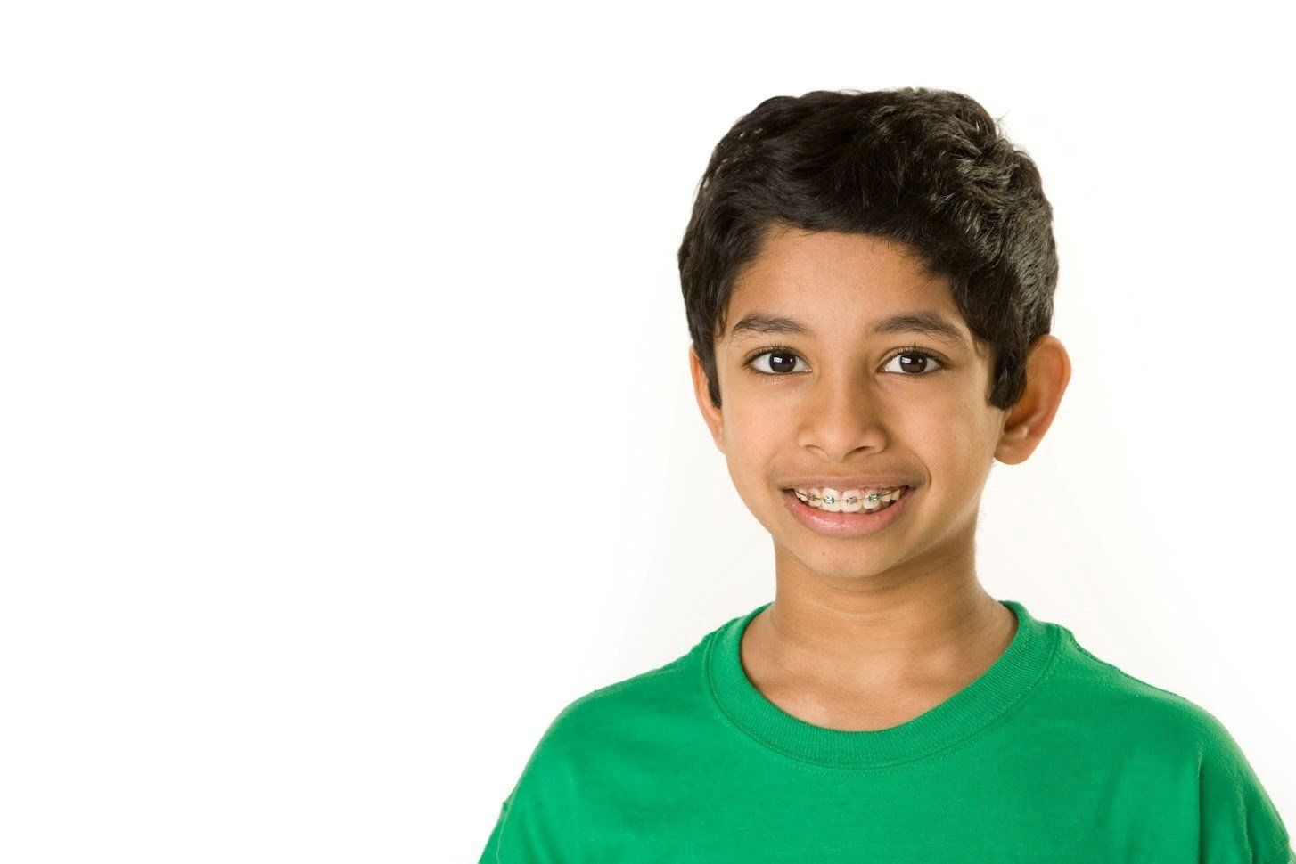 Boy with braces wearing green shirt — Buffalo Grove, IL — Rosen Orthodontics Boy with braces wearing green shirt — Buffalo Grove, IL — Rosen Orthodontics