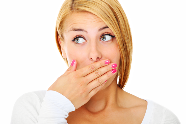 Woman covering her mouth — Buffalo Grove, IL — Rosen Orthodontics Woman covering her mouth — Buffalo Grove, IL — Rosen Orthodontics