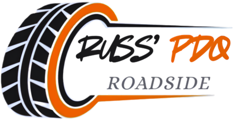 Russ&rsquo; Pro Roadside logo with black tire graphic and orange accent text