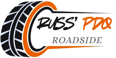Russ&rsquo; Pro Roadside logo with black tire graphic and orange accent text