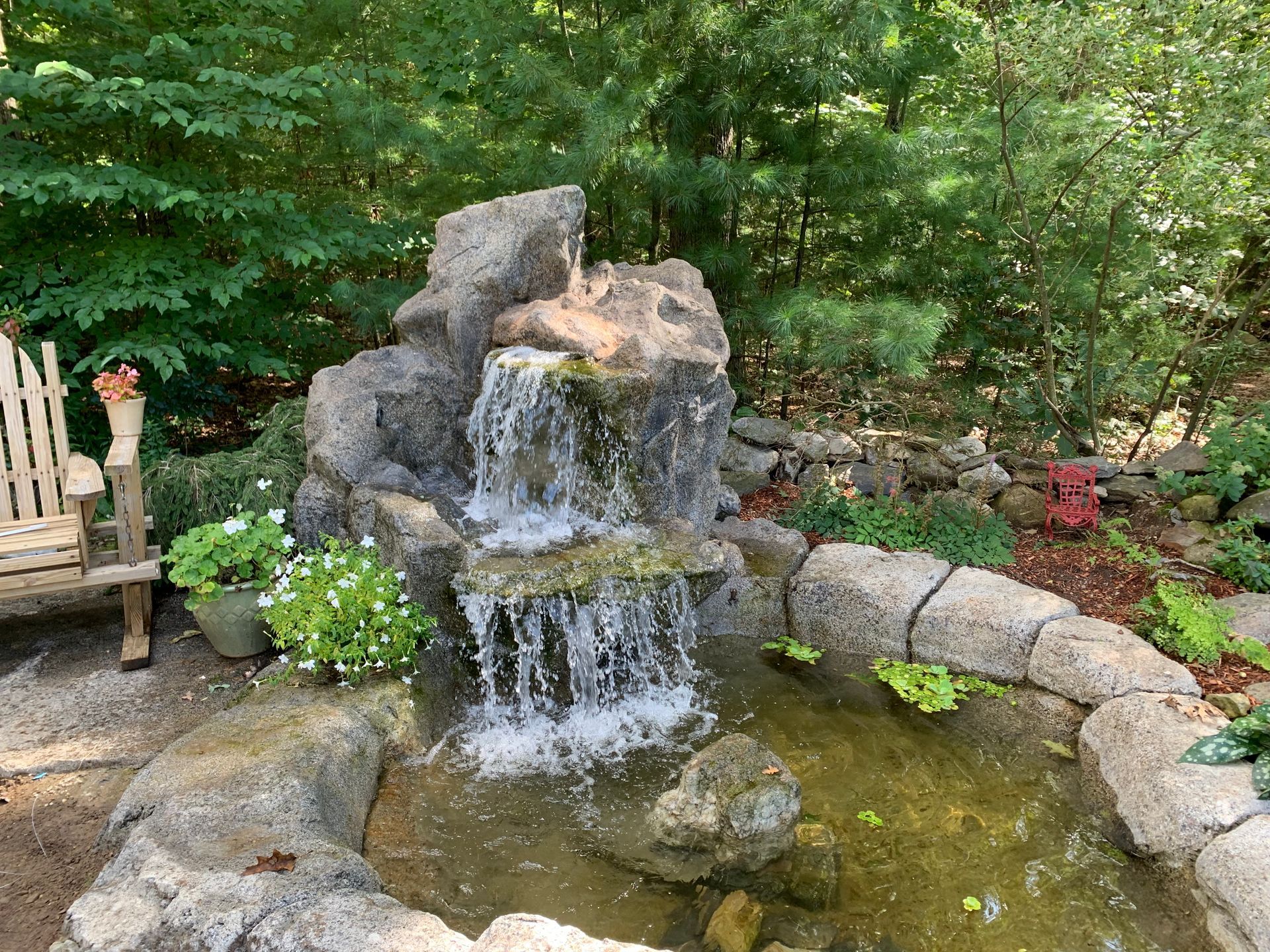 Elite Outdoor Living Solutions is installing a nature vibe garden pond with a waterfall in Oklahoma City.
