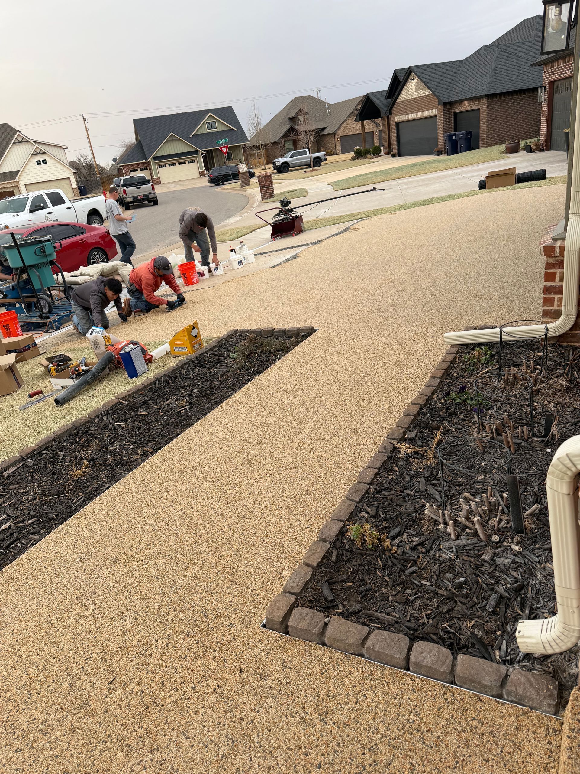 Elite Outdoor Living Solutions is installing a custom pool with a built-in hot tub in Oklahoma City.