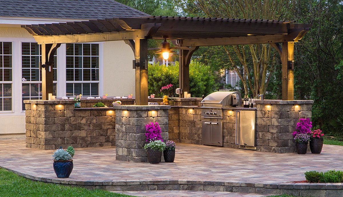 Elite Outdoor Living Solutions designed an outdoor kitchen with concrete counters and pregola in Quail Creek, OKC. 