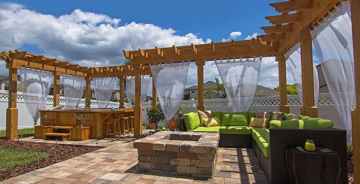 Elite Outdoor Living Solutions is installing a pergola patio with a fire pit and couch in Oklahoma City.