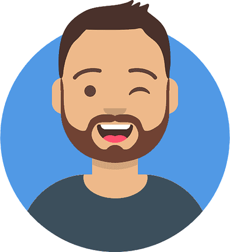 A man with a beard is smiling and making a wink.