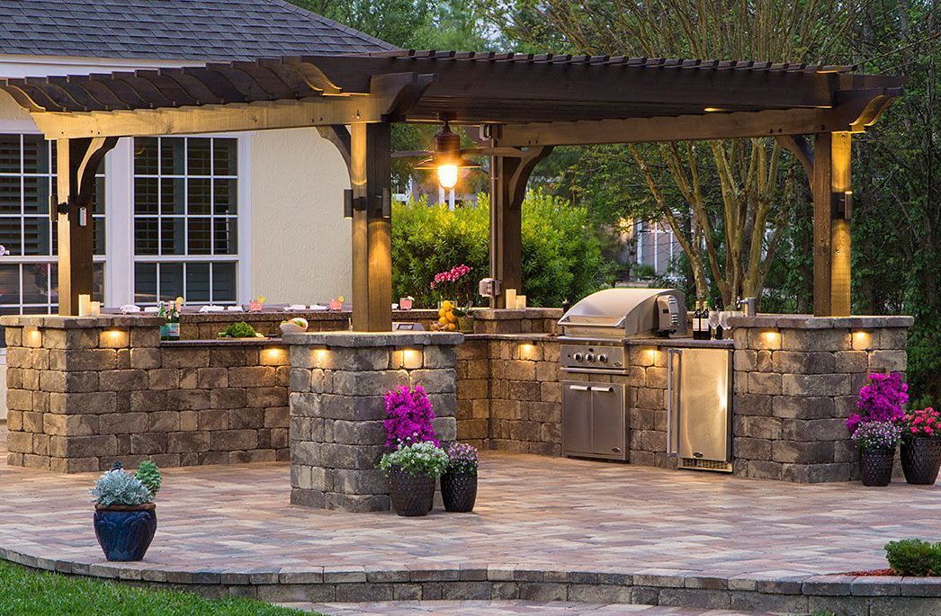 Outdoor Living Solutions is installing a custom patio with a pergola and outdoor kitchen in Oklahoma City.