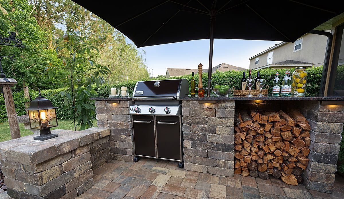 Elite Outdoor Living Solutions is installing an outdoor kitchen with a grill and seating in Oklahoma City.