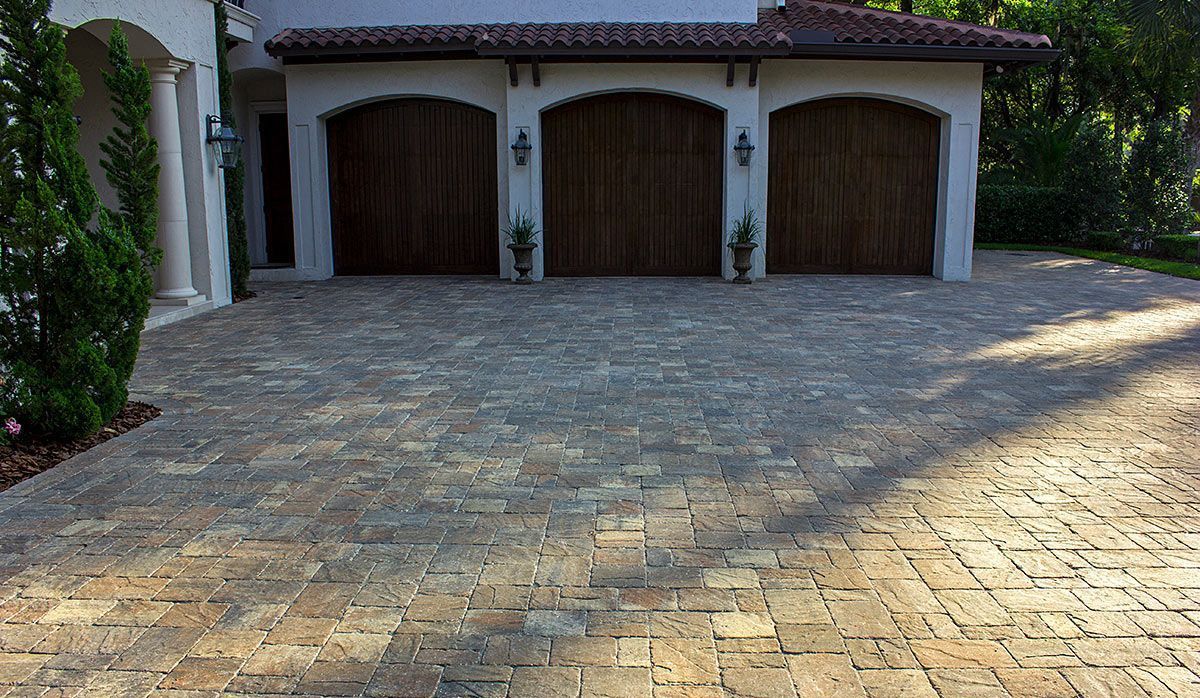 Elite Outdoor Living Solutions is installing a gorgeous brown brick driveway for a home in Oklahoma City.