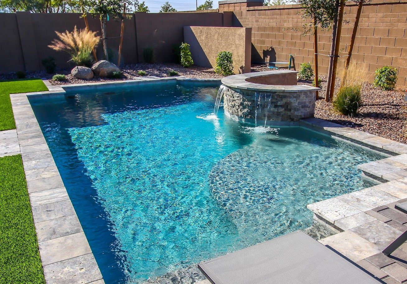 Elite Outdoor Living Solutions is installing a backyard swimming pool with a waterfall in Oklahoma City.