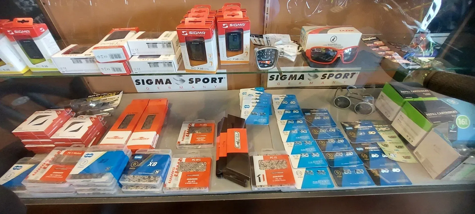 A display case filled with a variety of cell phones and accessories.