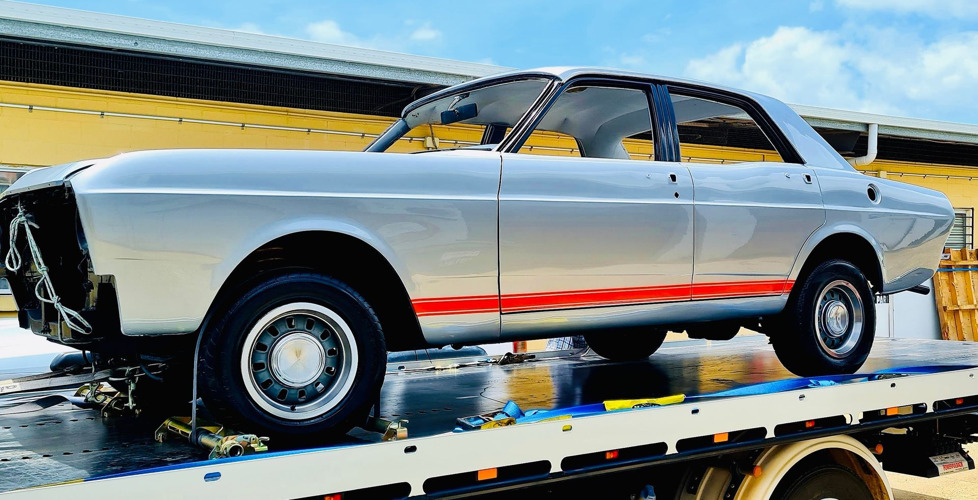 Silver Classic Car on A Tow Trailer — Straightline Detailing Cairns in Bungalow, QLD