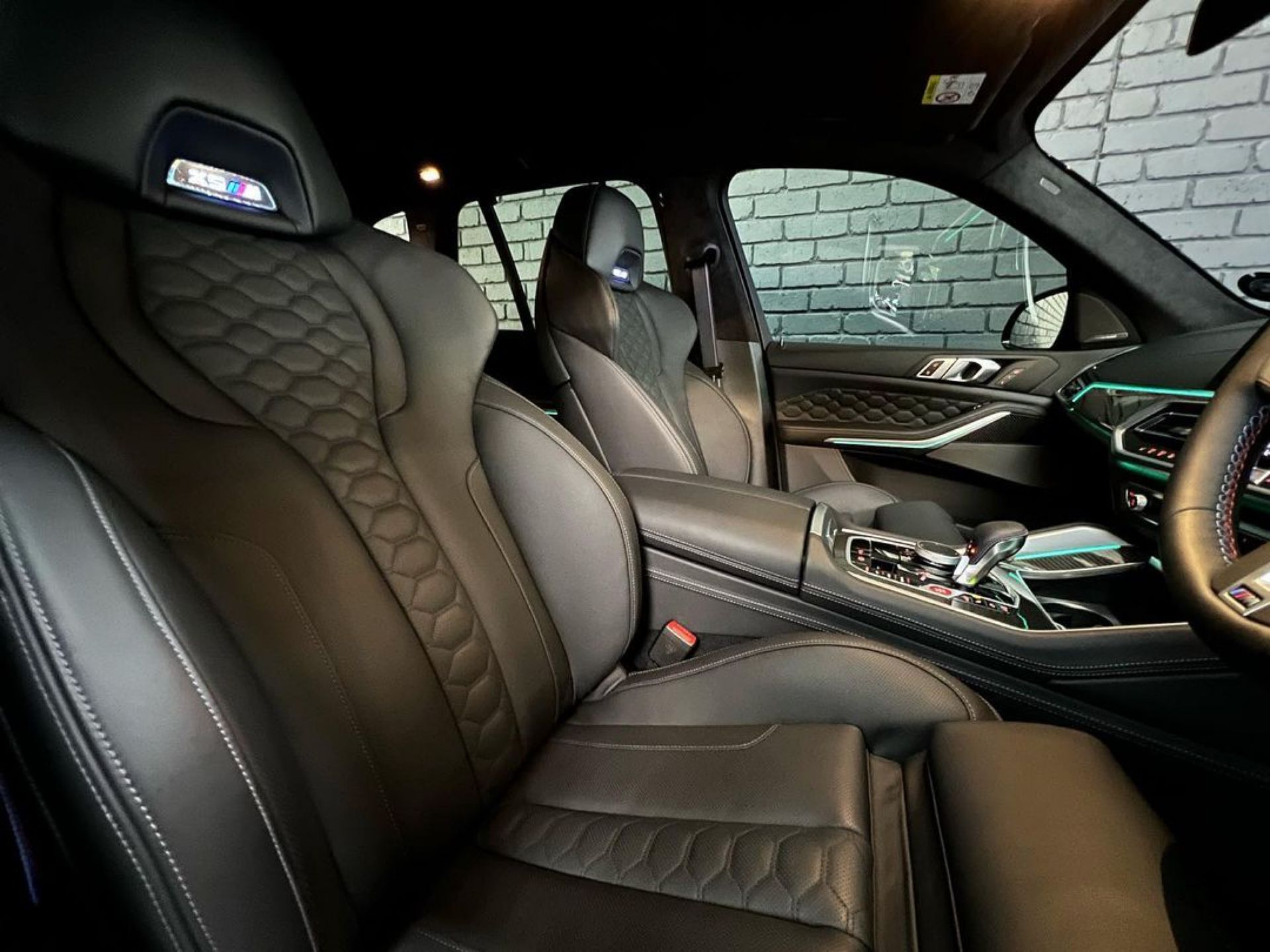 Luxury Car Interior with Black Quilted Leather Seats and Center Console — Straightline Detailing Cairns in Bungalow, QLD