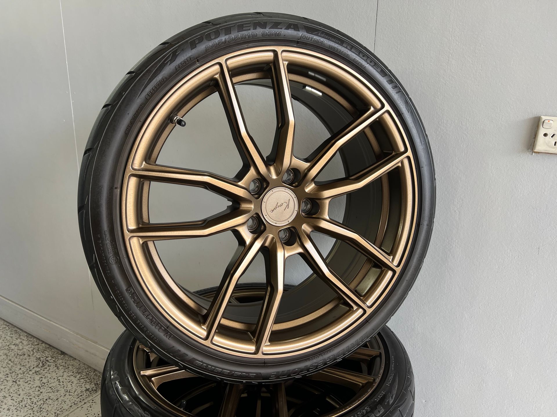 Bronze Alloy Wheel with Tire — Straightline Detailing Cairns in Bungalow, QLD