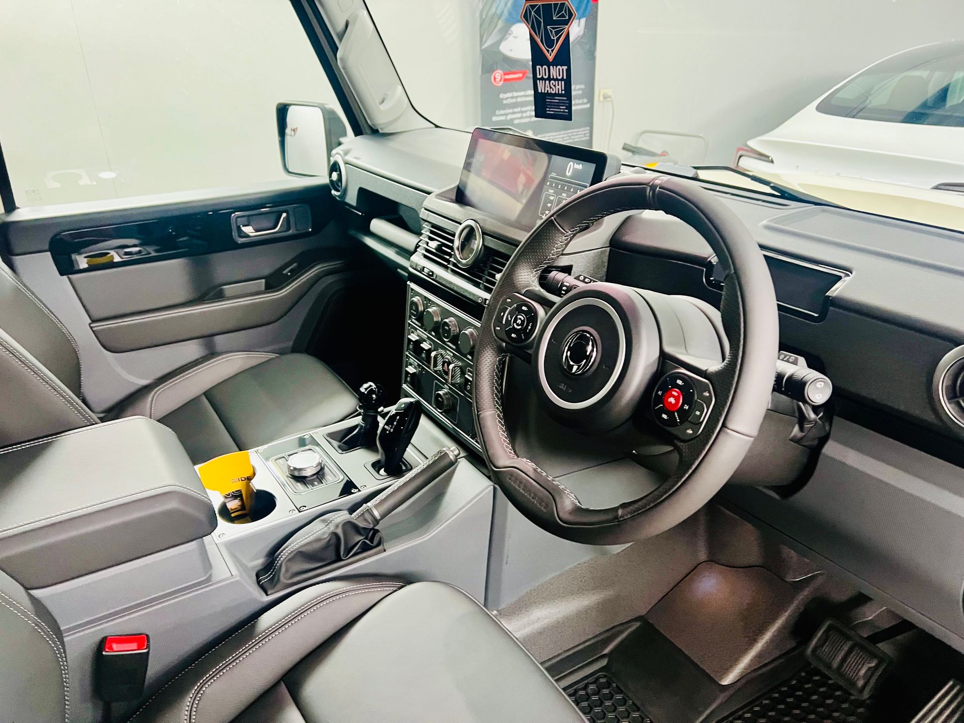 Modern Car Interior with Right-Hand Drive, Black Steering Wheel — Straightline Detailing Cairns in Bungalow, QLD