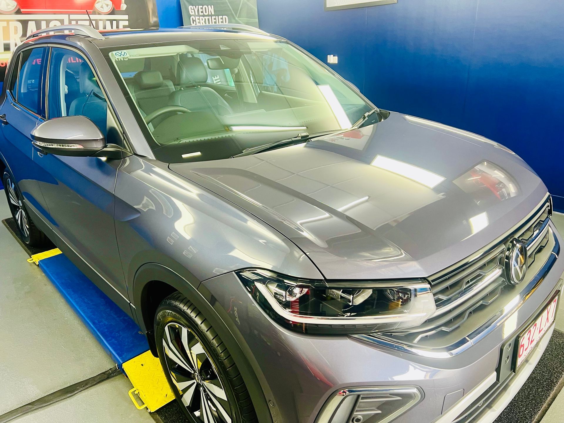 Gray SUV On a Display Platform at An Auto Show — Straightline Detailing Cairns in Bungalow, QLD