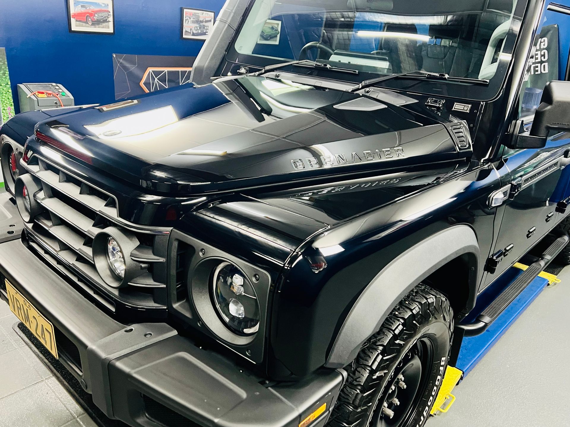 Black off-road SUV In a Garage, Front-Left View, with Shiny Paint — Straightline Detailing Cairns in Bungalow, QLD