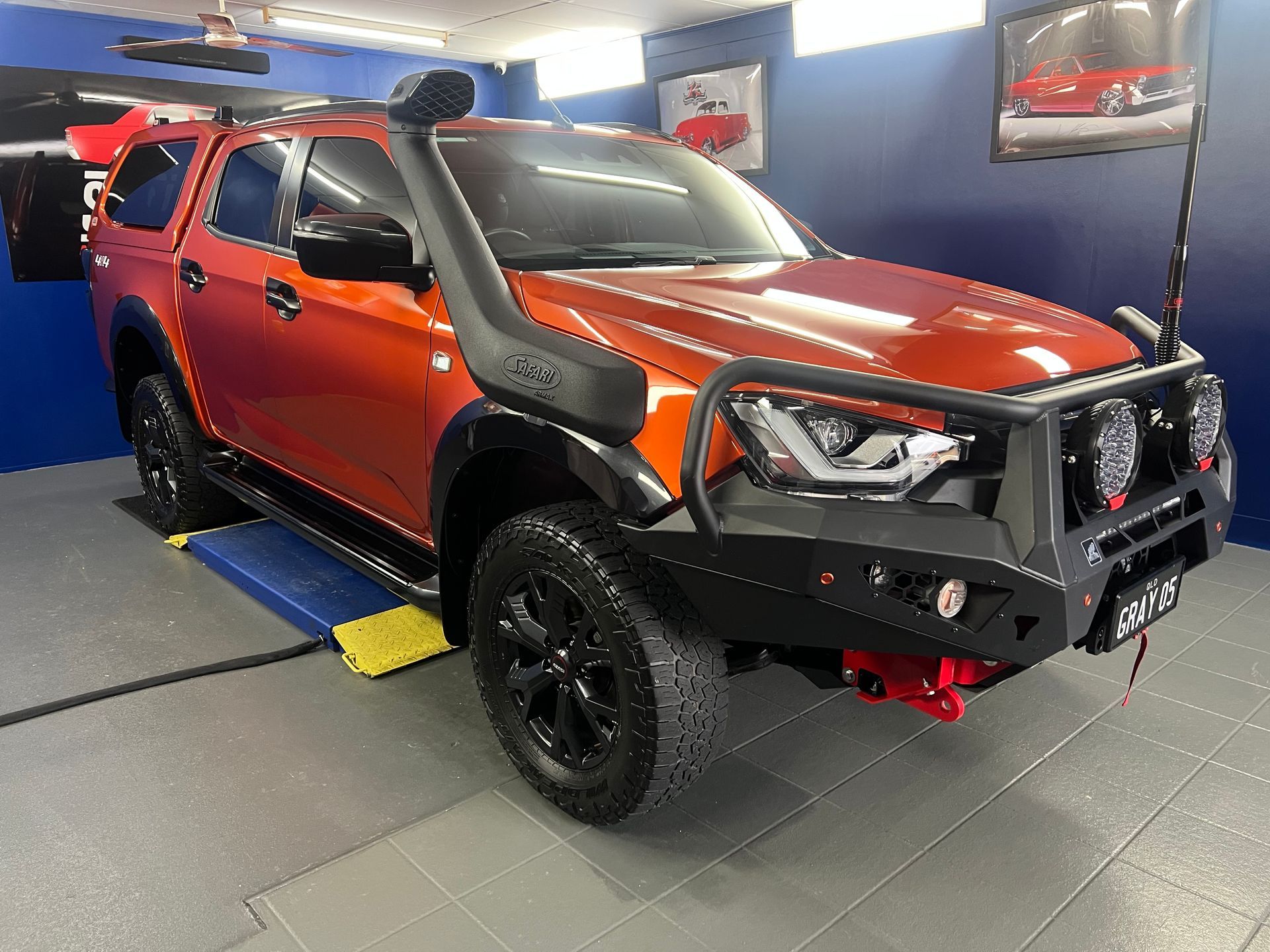 Orange Off-Road Pickup Truck in A Garage — Straightline Detailing Cairns in Bungalow, QLD