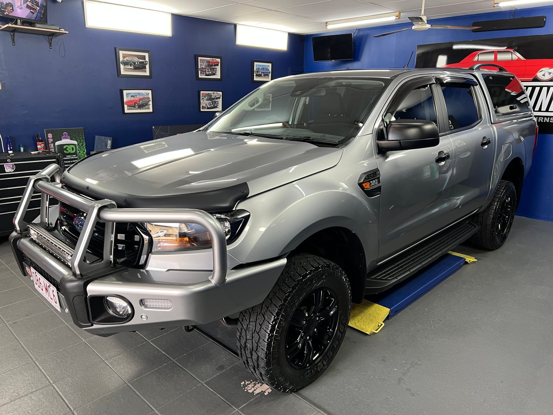 Gray Pickup Truck with Off-Road Bumper in A Garage Workshop — Straightline Detailing Cairns in Bungalow, QLD