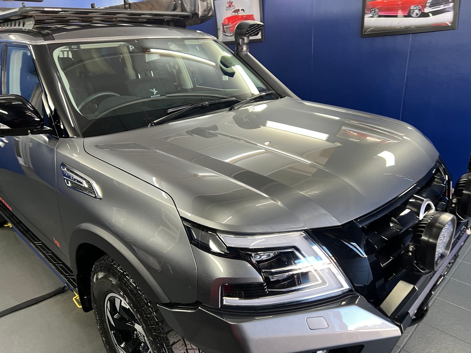 Silver Pickup Truck Displayed Indoors in A Showroom — Straightline Detailing Cairns in Bungalow, QLD