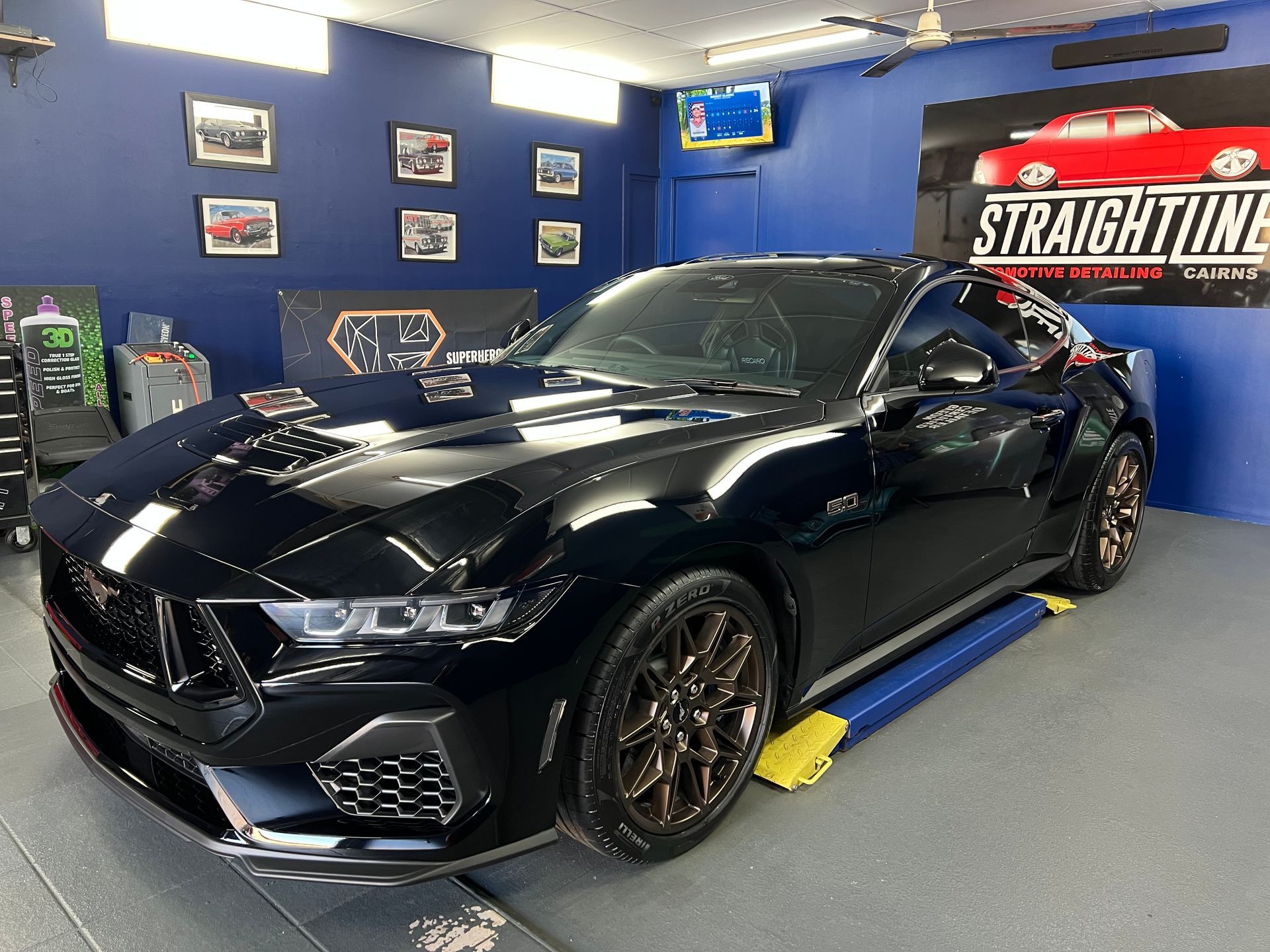 Black Sports Coupe in A Blue Auto Shop — Straightline Detailing Cairns in Bungalow, QLD