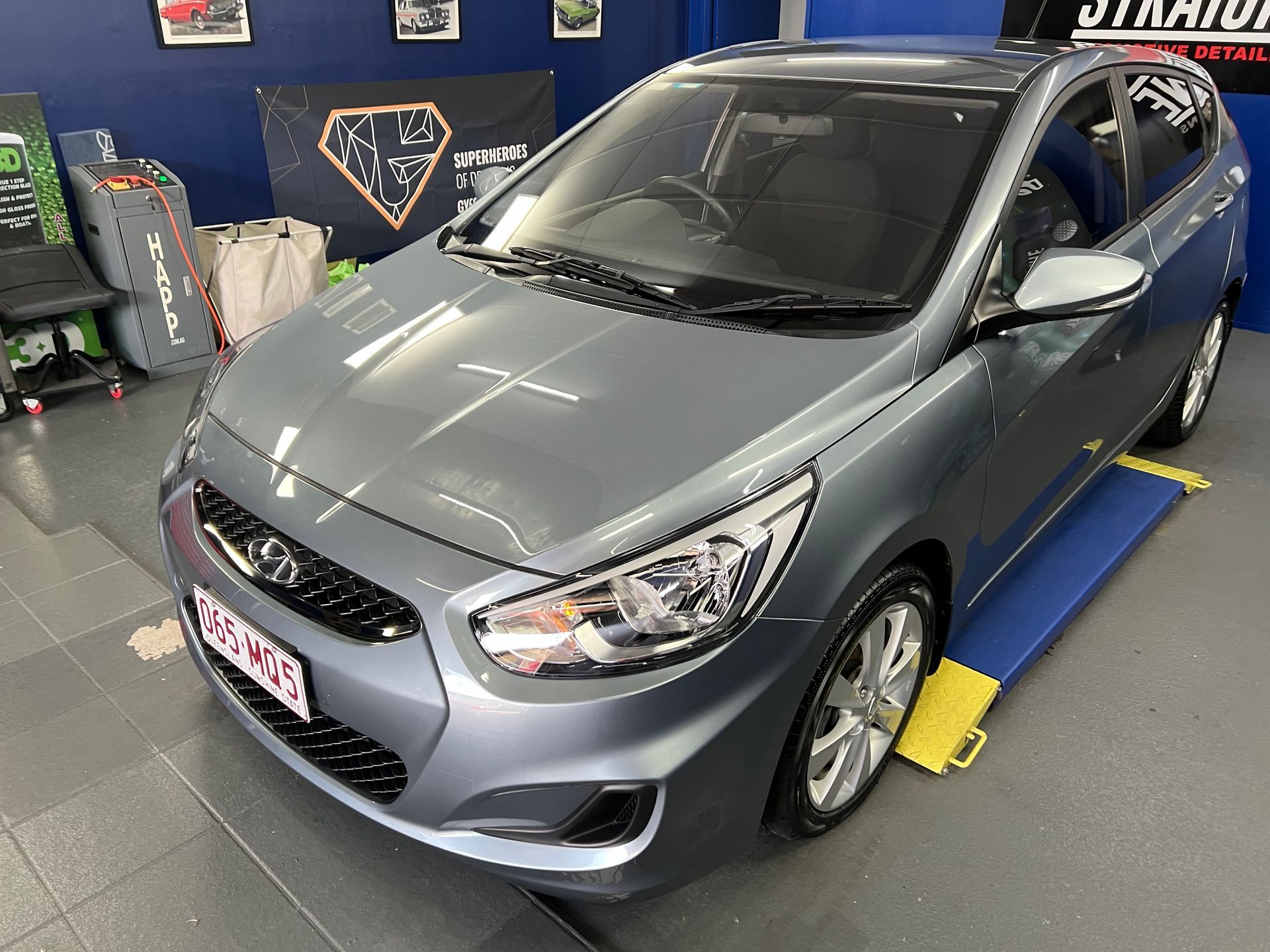 Silver Hatchback Car on A Workshop Lift in An Auto Repair Garage — Straightline Detailing Cairns in Bungalow, QLD