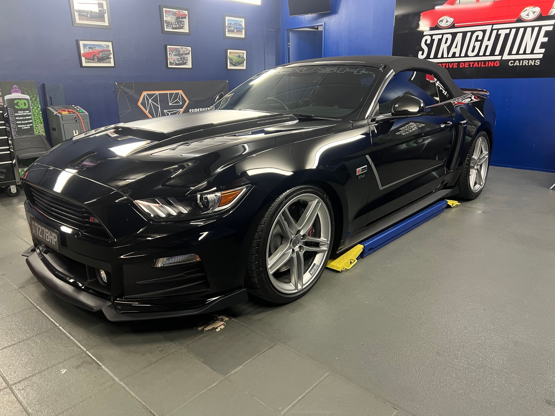 Black Sports Car in A Garage Showroom — Straightline Detailing Cairns in Bungalow, QLD