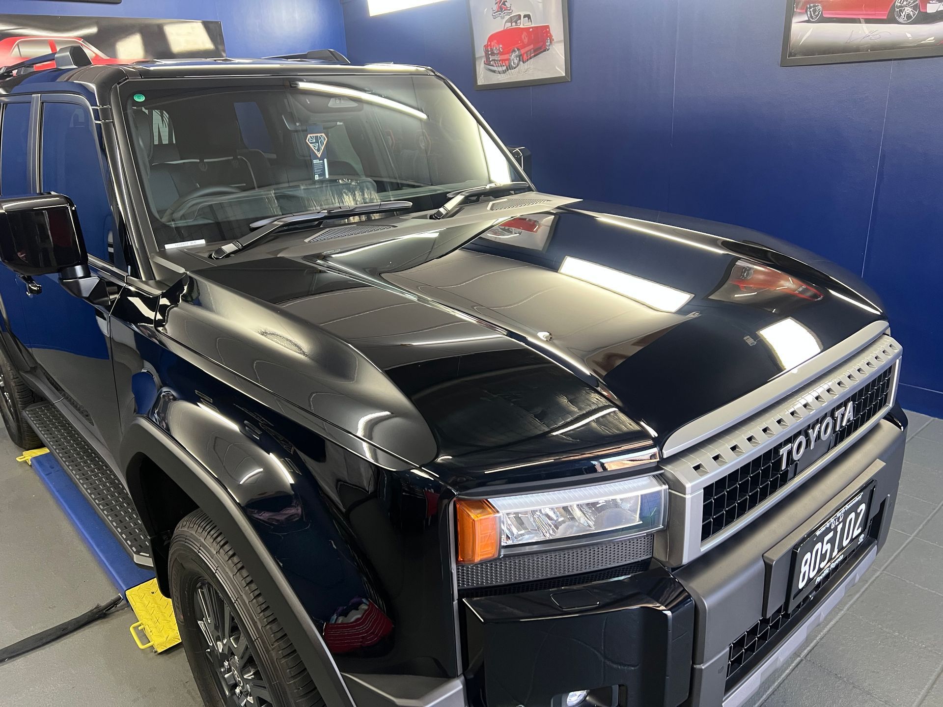 Black Toyota SUV In a Showroom, Front-Left View — Straightline Detailing Cairns in Bungalow, QLD