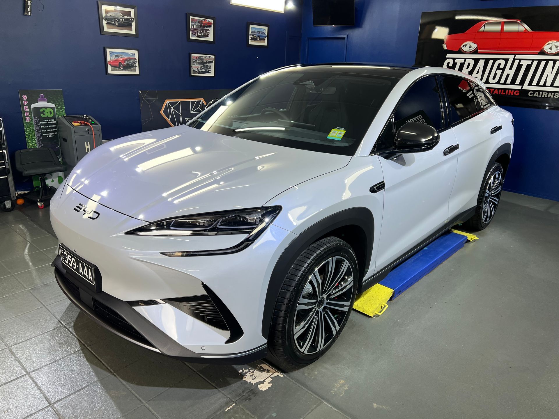 White Suv Displayed in A Showroom with Blue Walls — Straightline Detailing Cairns in Bungalow, QLD