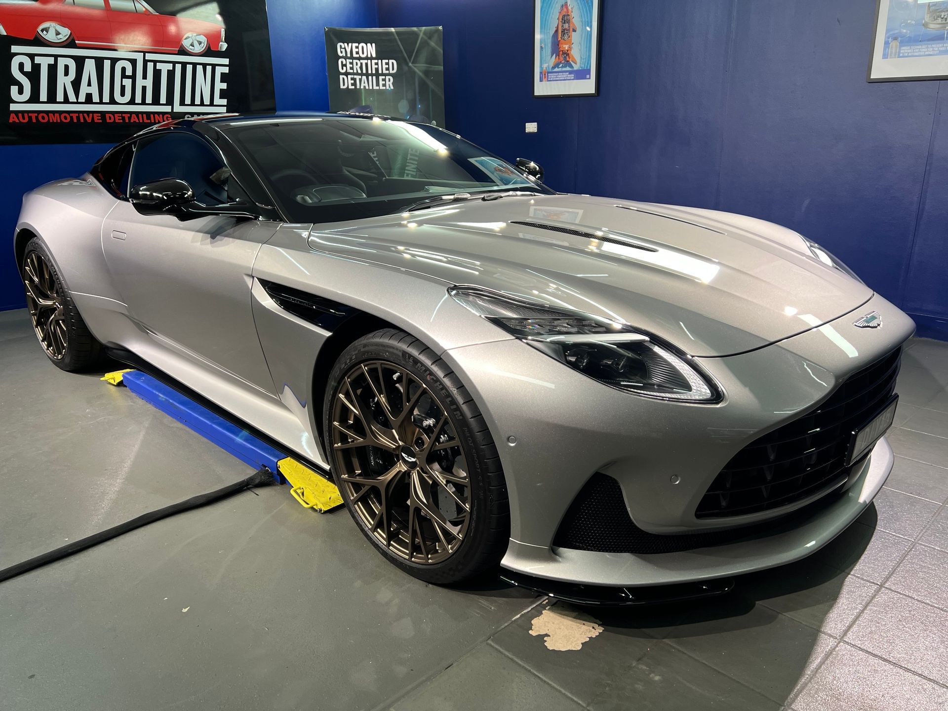 Silver Sports Car Displayed Indoors in A Showroom — Straightline Detailing Cairns in Bungalow, QLD