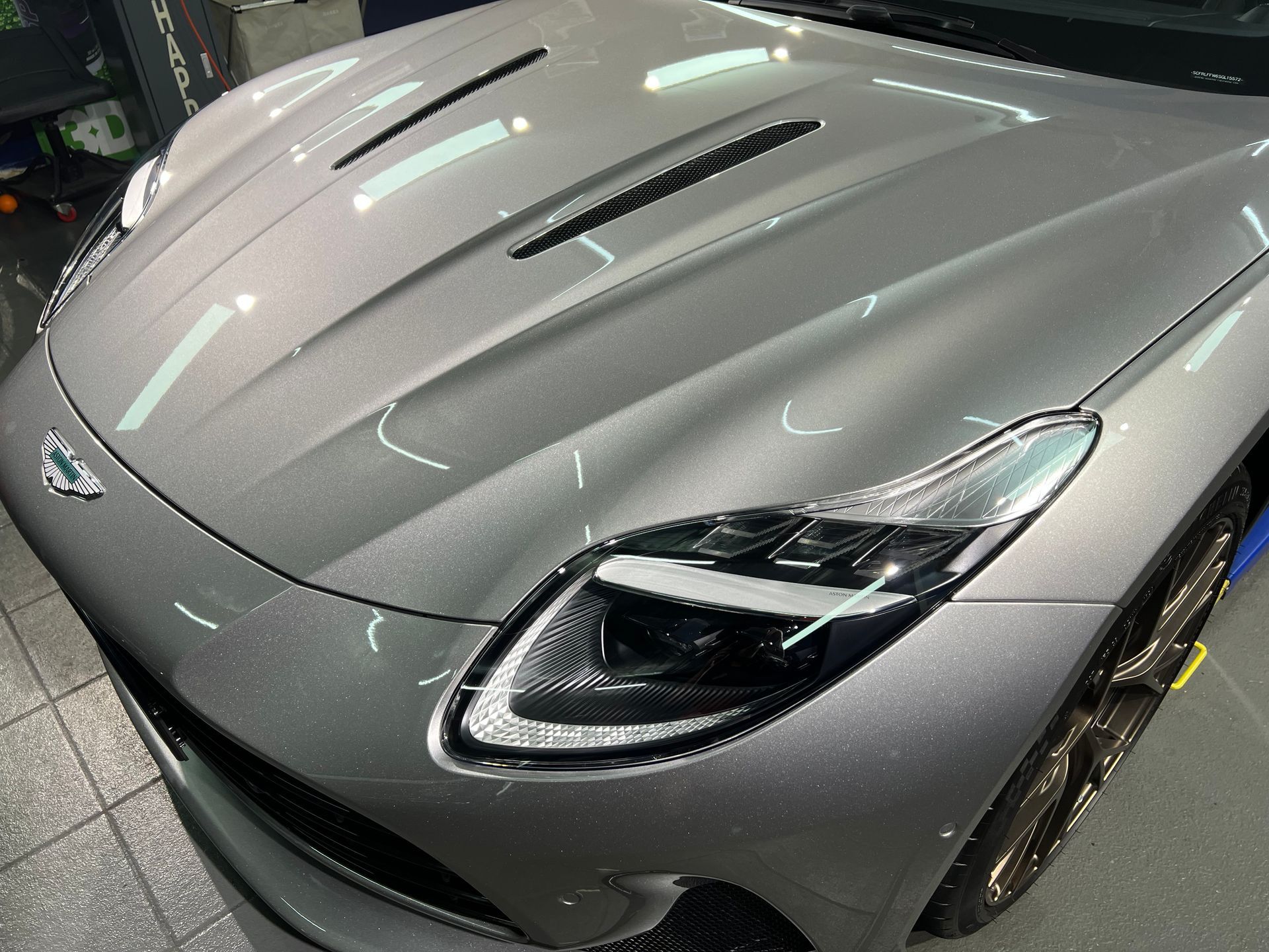 Silver Sports Car in A Showroom, Viewed from Above