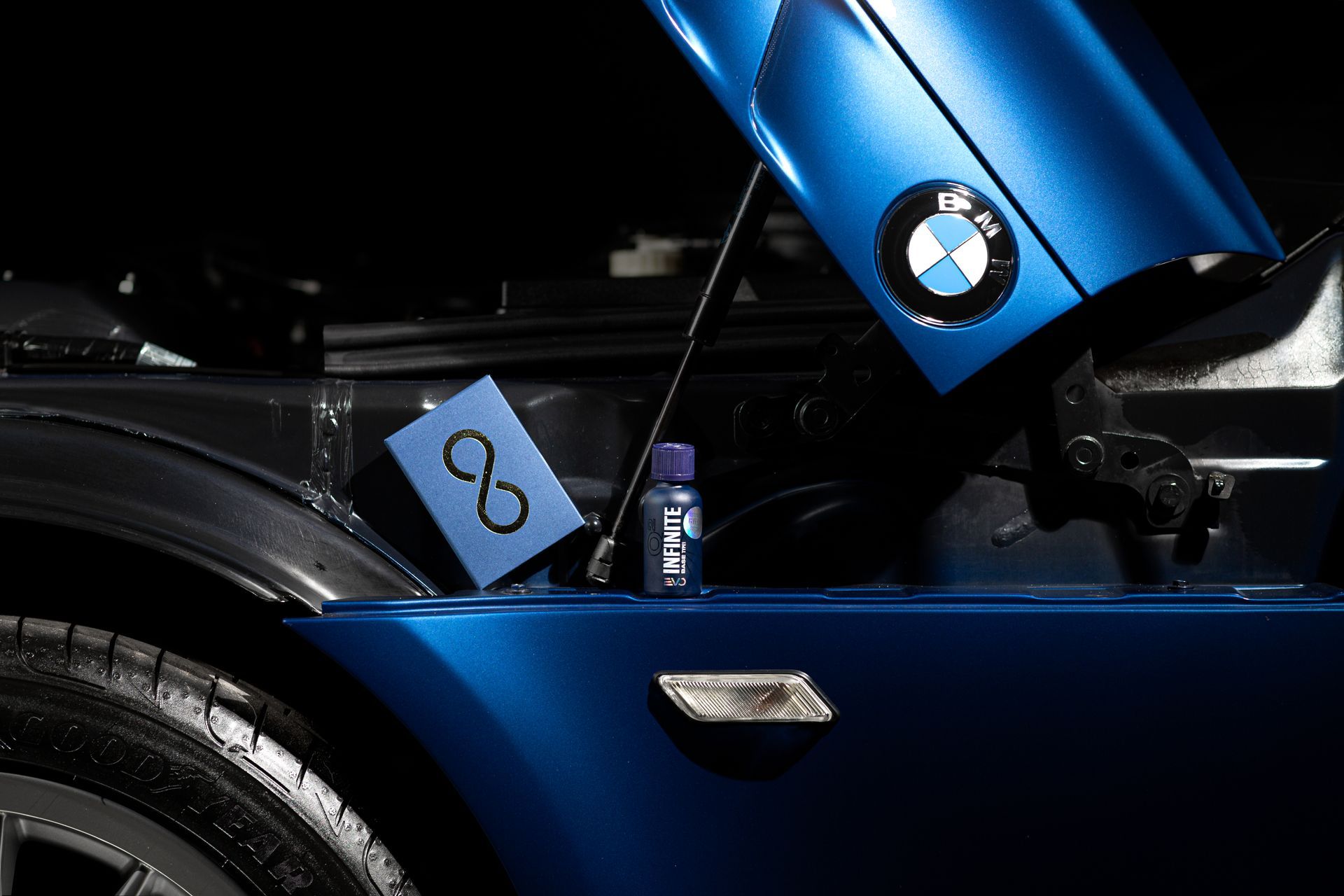 Blue BMW Car with Hood Open at Night — Straightline Detailing Cairns in Bungalow, QLD
