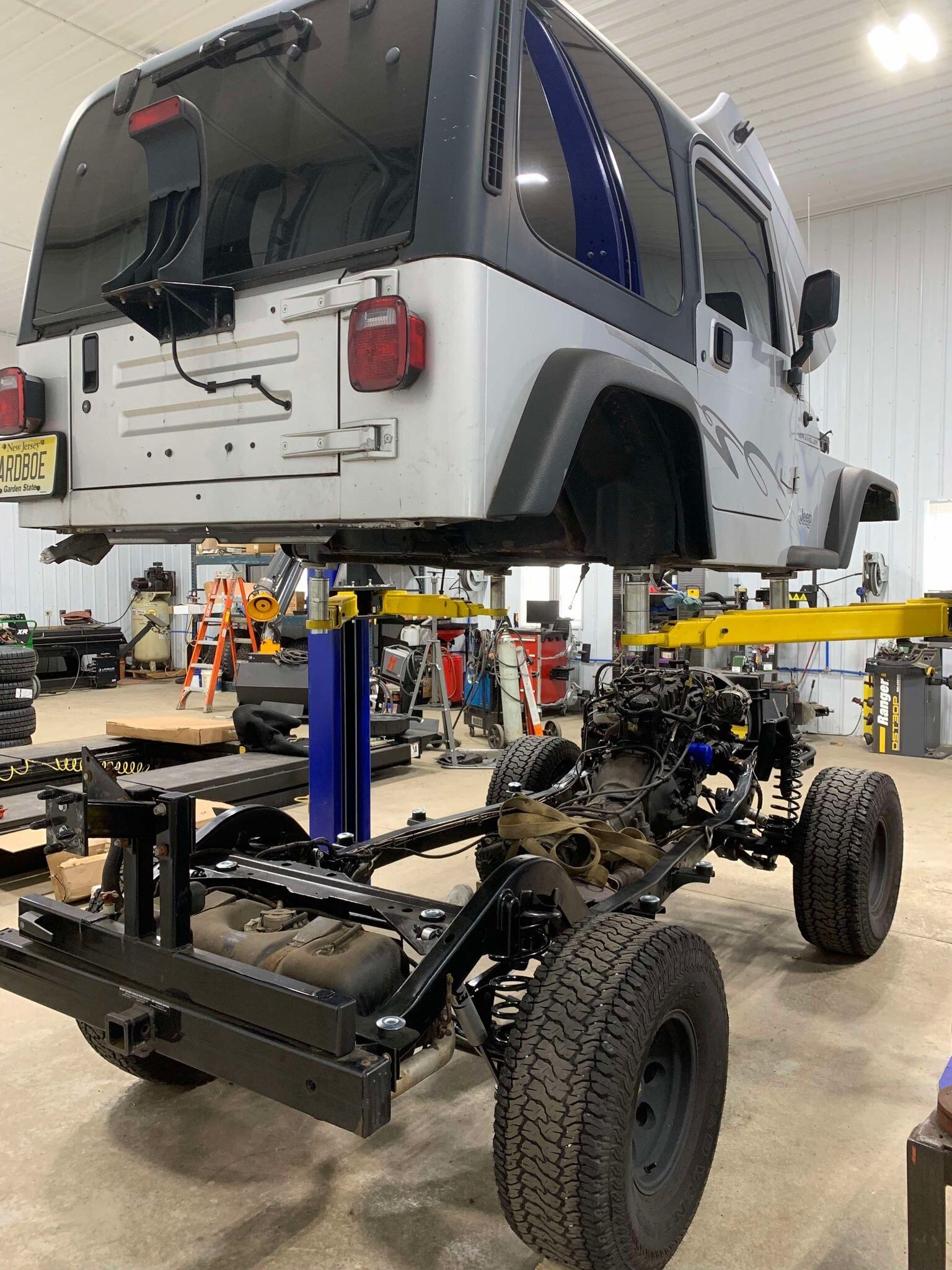 A truck is being dismantled in a garage.  | DirtLife Fab & 4x4