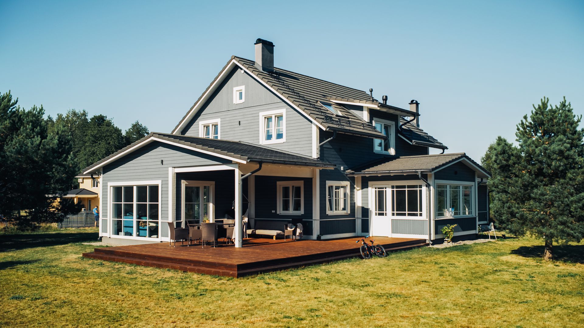 A Large House With A Large Deck In The Middle Of A Lush Green Field – Warrnambool, VIC - Taits Legal