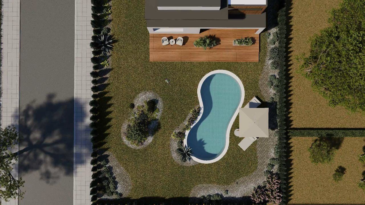 Aerial view of a property showing lawn, planting beds, a pool and a deck.