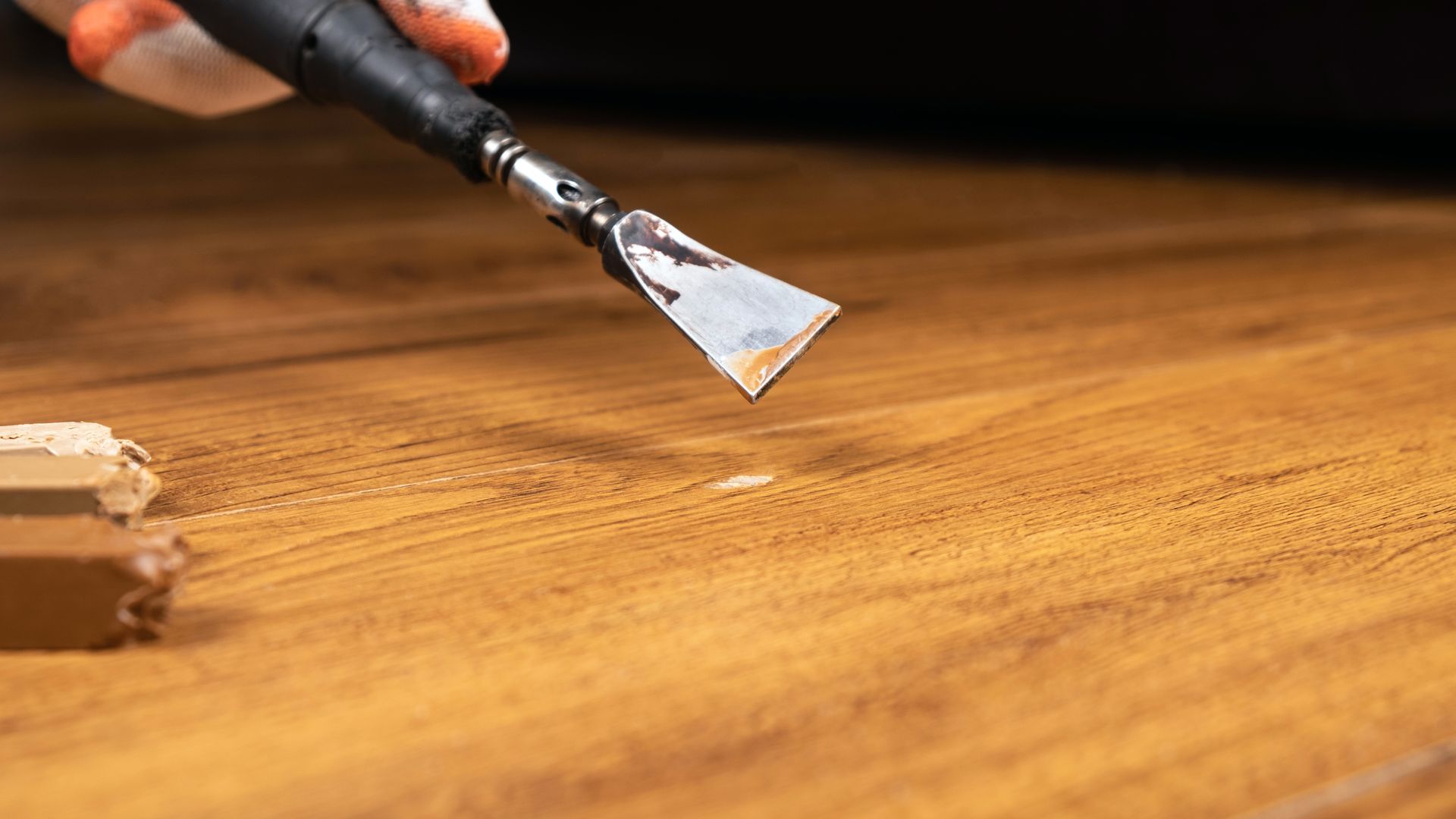 Picture of a wood floor that needs repair