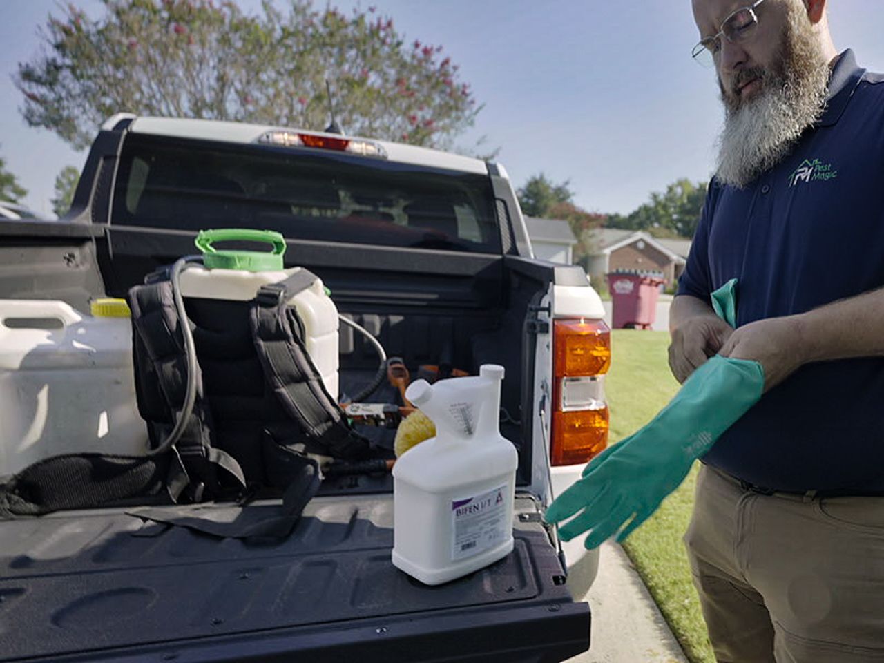 Termite control technician applying so