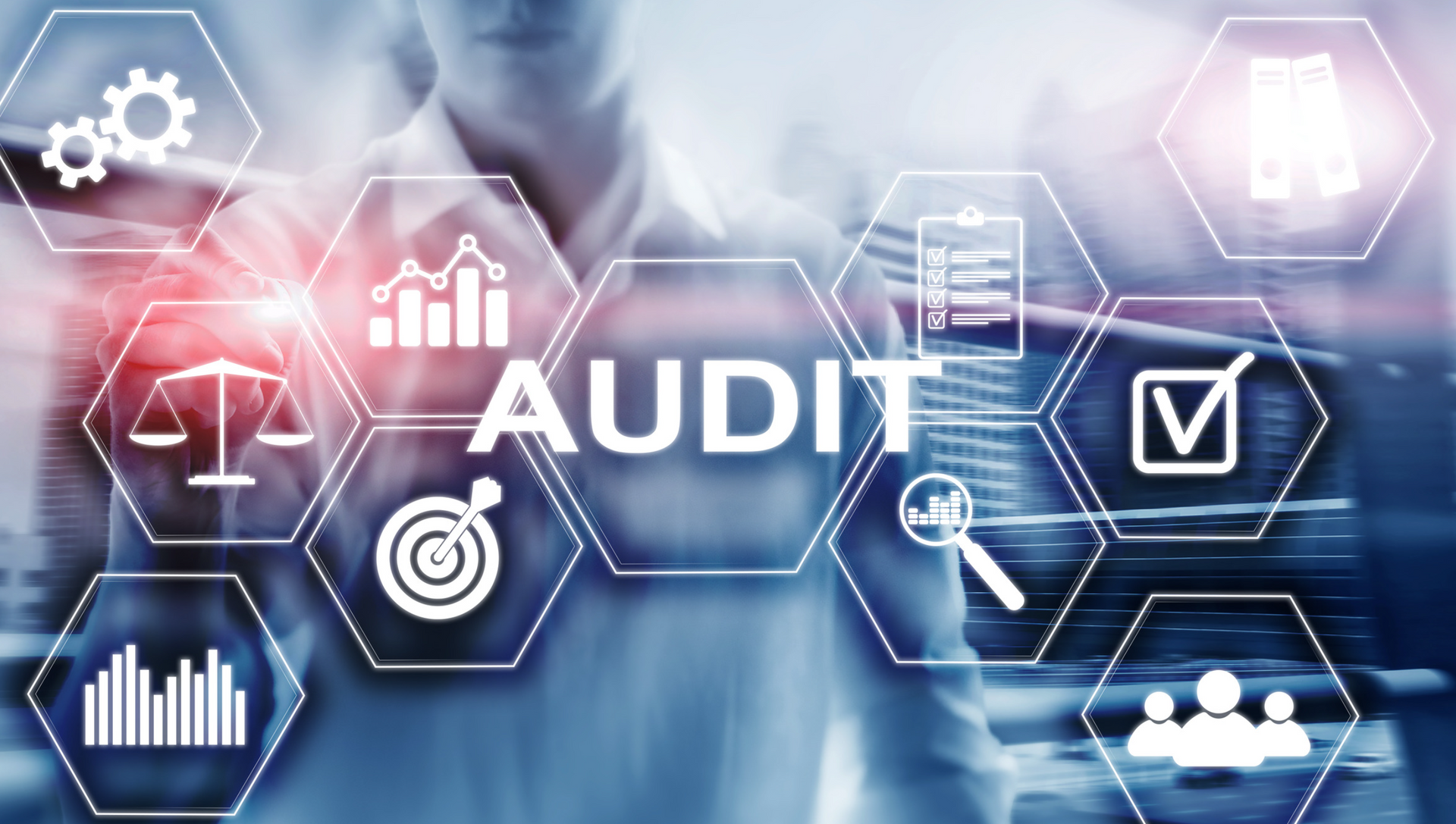 A person is pressing a button on a screen that says audit.