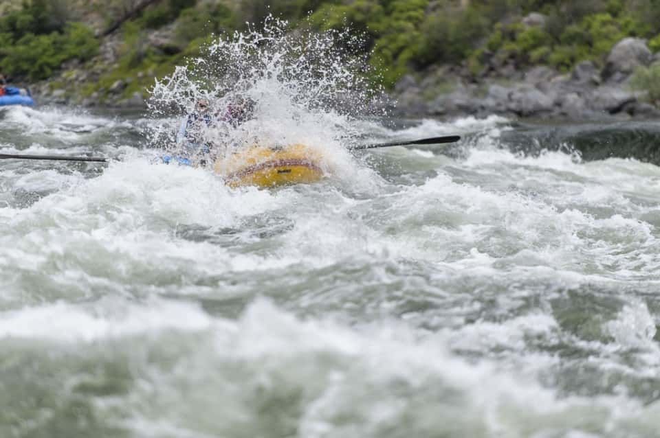 Yellow Raft Get Splash of Water on River