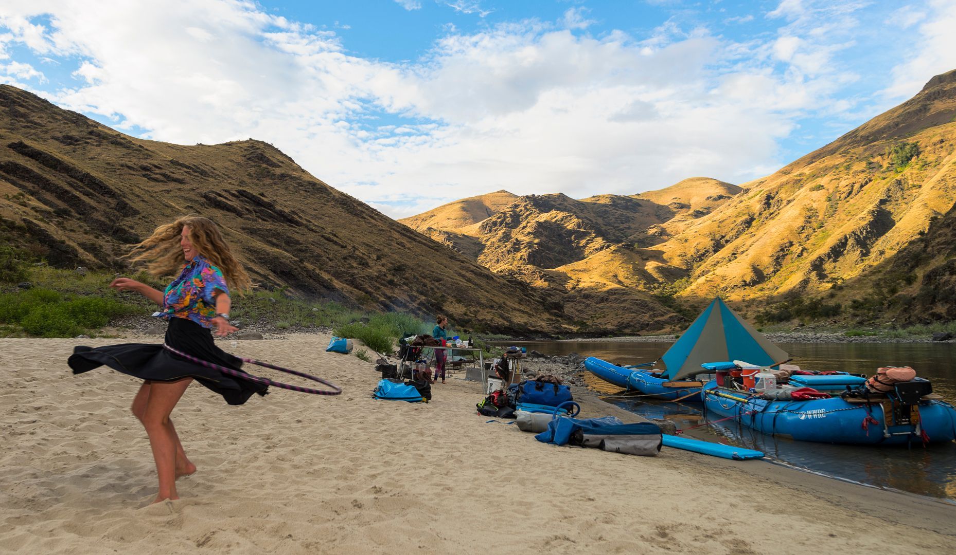 River Rafting Camp With Hula Hooper On Sandy Beach