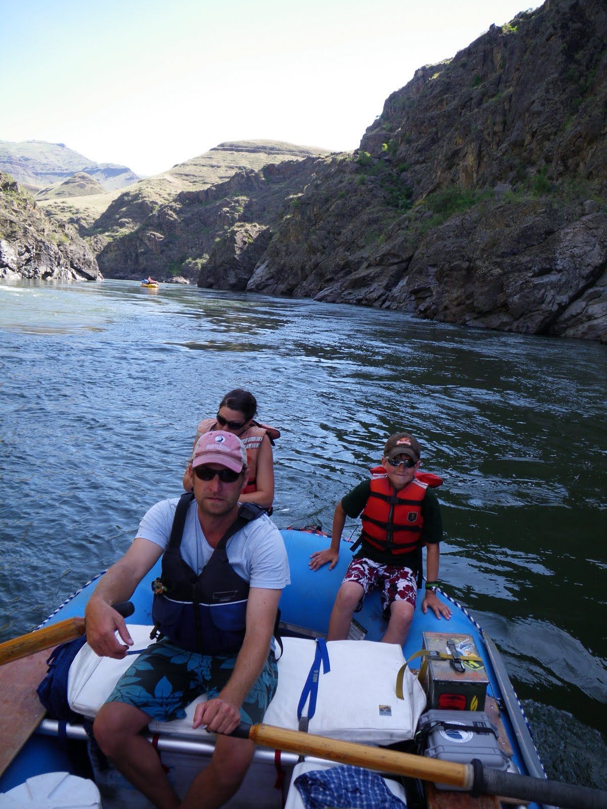 A group of people are in a raft on a river